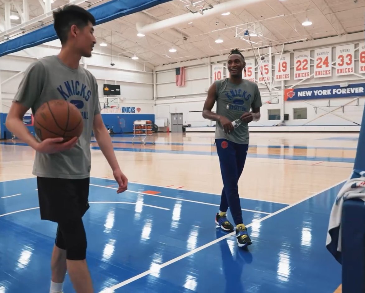 Coach and athlete on a professional basketball court